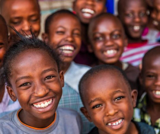 Group of happy African children living in an orphanage in Kenya, East Africa